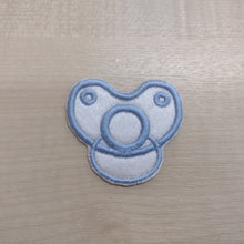 Motif Patch Baby Dummy Front View