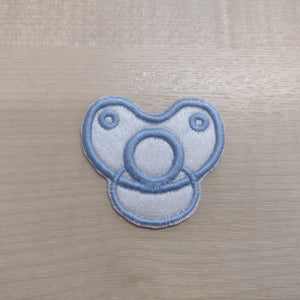 Motif Patch Baby Dummy Front View